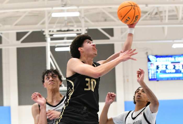 Aaron Hunkin-Claytor goes in for two of his 12 points for Salesian.